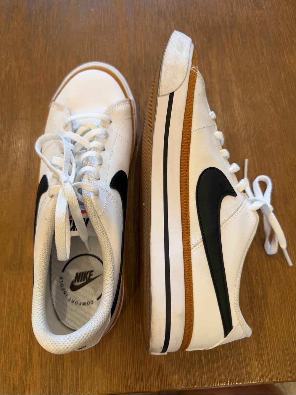 Nike White Low-Top Sneakers with Black Swoosh and Desert Trim